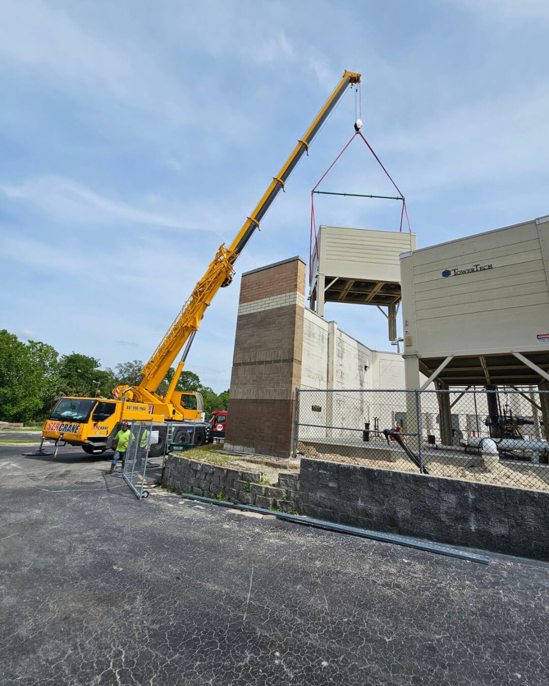crane lifting white container